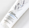 Tube of Color Wow Color Security conditioner on a light gray background