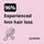 Advertisement for GLOWWA with text about less hair loss on a pink background